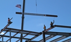 steelworkers on construction beam